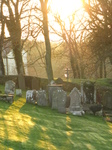 SX17378 Shadows and sunlight on gravestones at St David's Cathedral.jpg